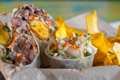 Cuba Cuba Sandwicheria signature dishes Coconut Ceviche & Mariquitas
Picadillo A Caballo
Roasted Pork Sandwich (Pan Con Lechon)